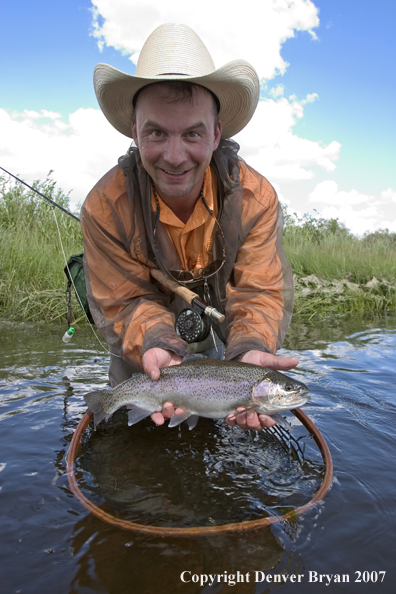 Flyfishermen with rainbow trout (MR).