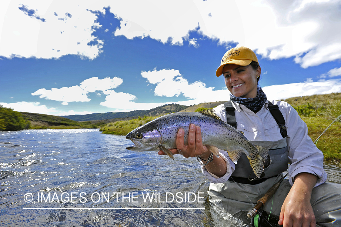 Flyfisher with rainbow trout.