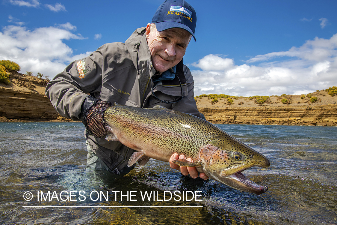 Flyfisherman with rainbow trout.