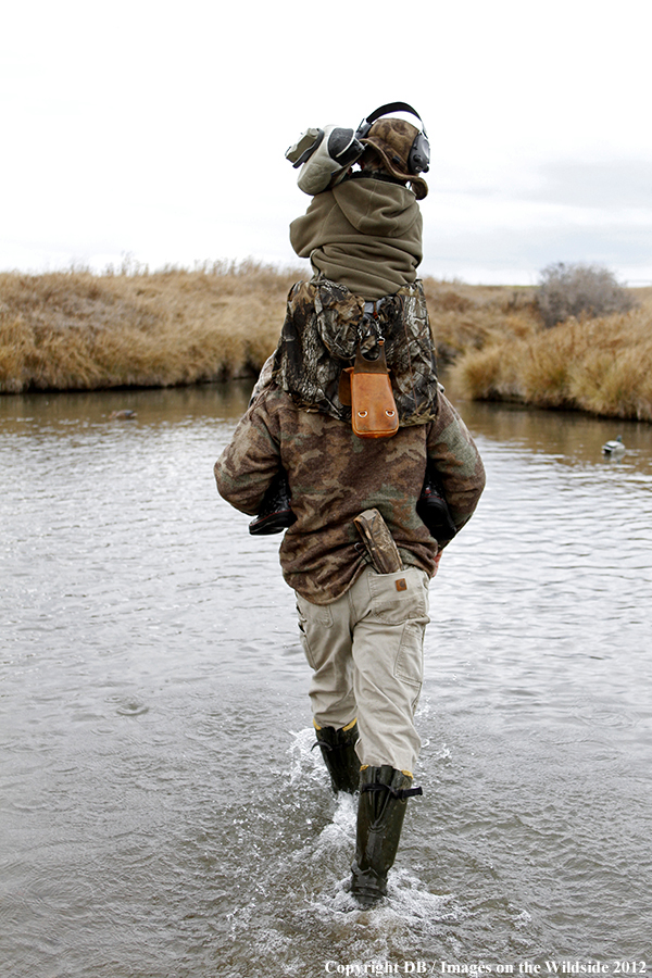 Father and son hunting waterfowl.