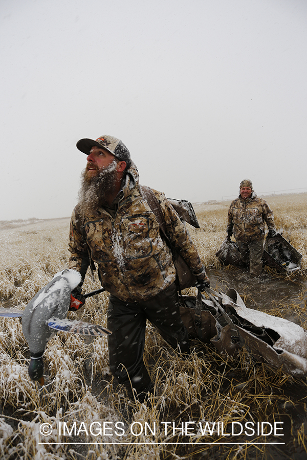 Duck hunters in winter snow condidtions.