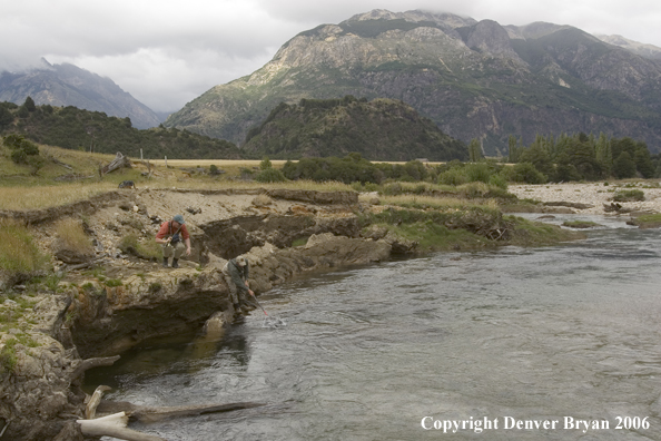 Flyfishermen netting fish.