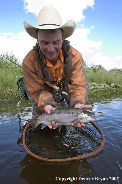 Flyfishermen with rainbow trout (MR).