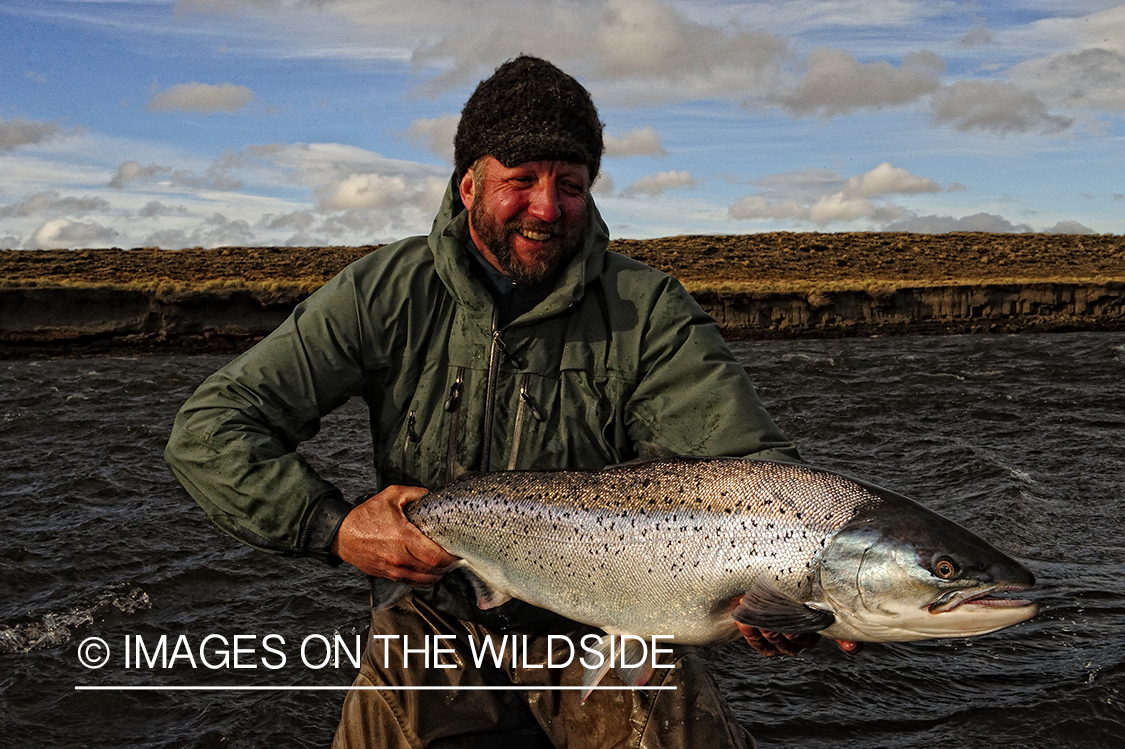 Flyfisherman with sea-run brown trout.