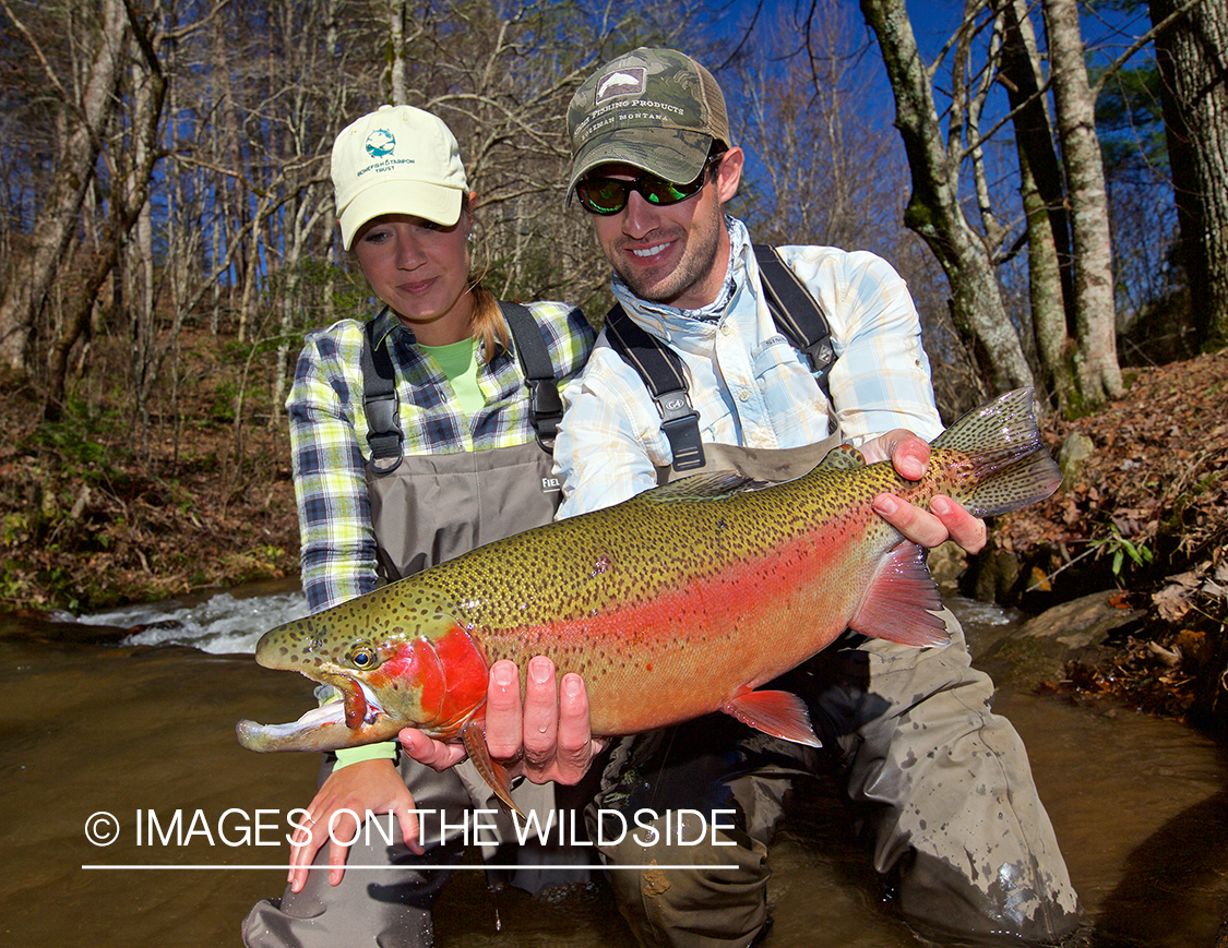 Flyfisherman with rainbow trout.