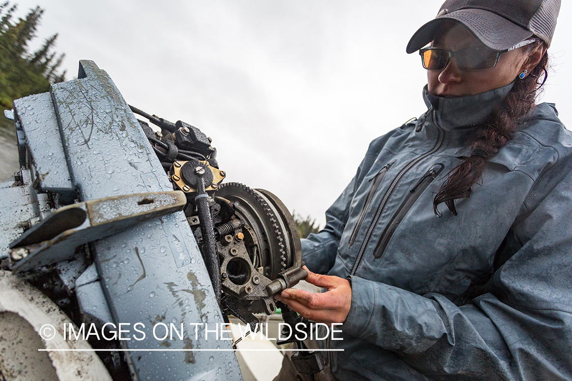 Camille Egdorf working on jetboat engine. 