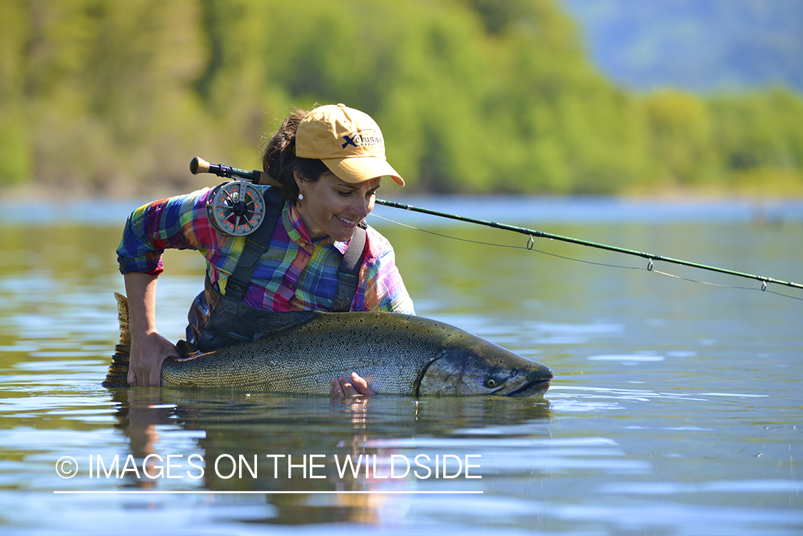 Flyfishing woman with king salmon.