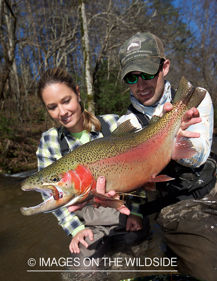 Flyfisherman with rainbow trout.