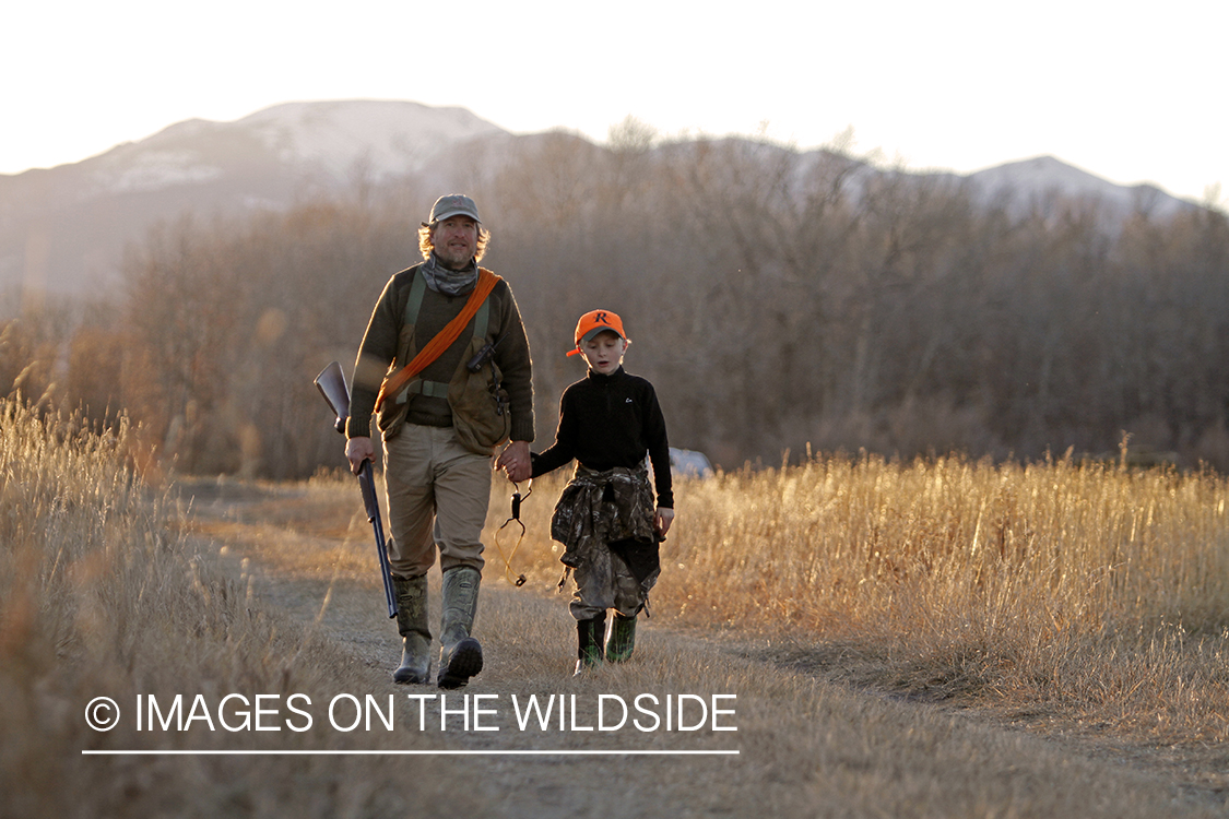 Father and son pheasant hunting.