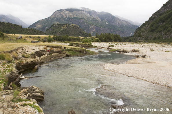 Flyfisherman casting on river.