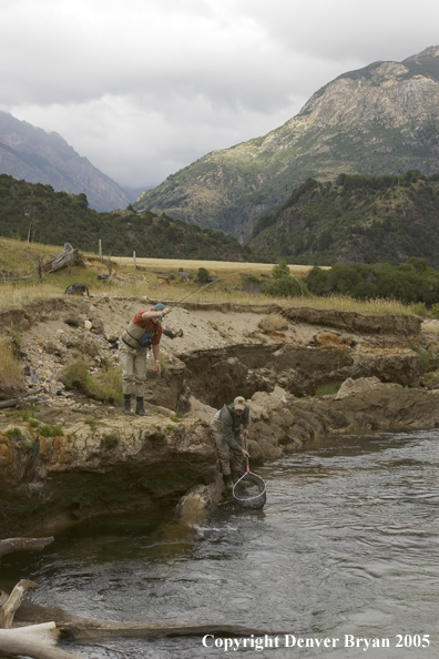 Flyfishermen netting fish.