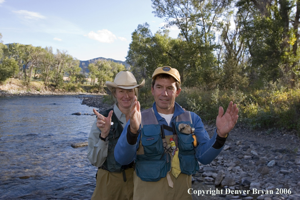 Flyfisherman and flyfisher woman on the river.