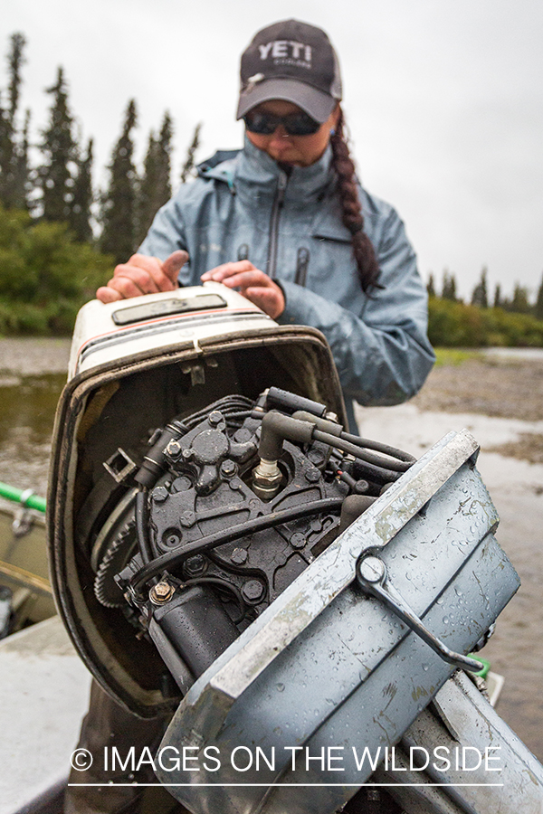 Camille Egdorf working on jetboat engine. 