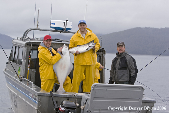 Fishermen with halibut and salmon catch.  (Alaska/Canada)