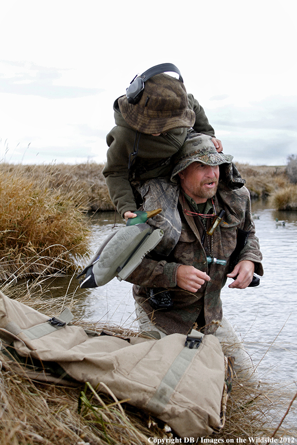 Father and son hunting waterfowl.