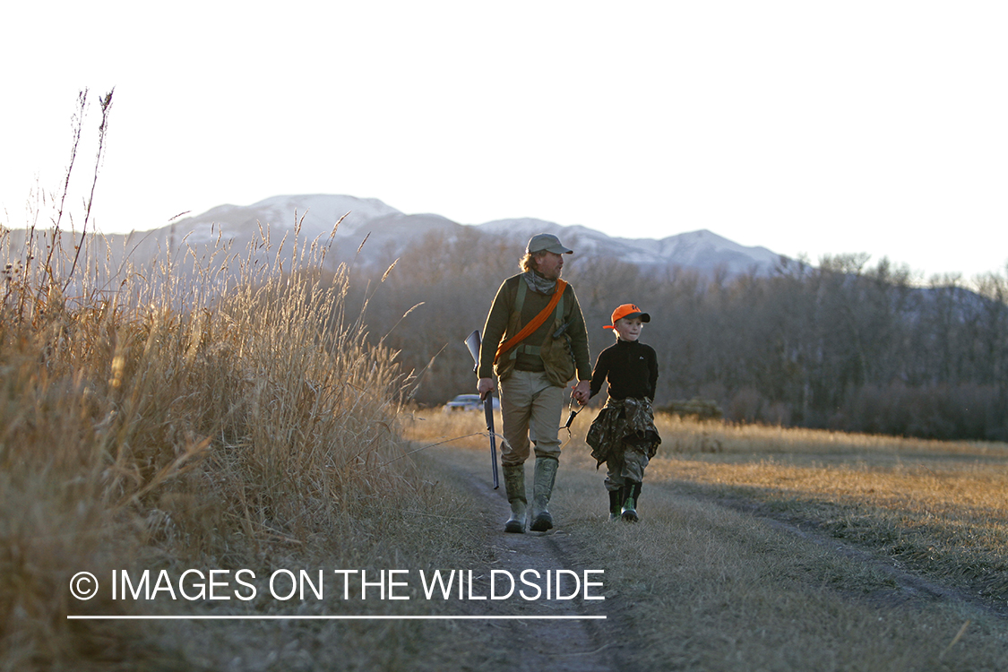 Father and son pheasant hunting.