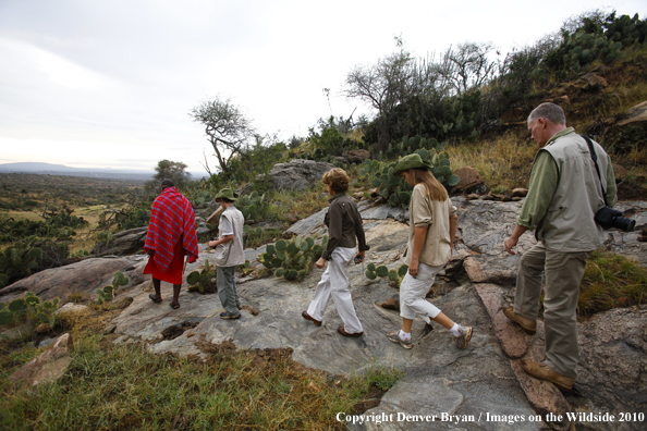 family hiking on african safari