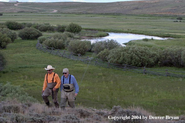 Flyfishermen walking back from river (MR)