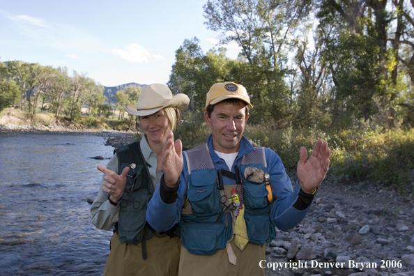 Flyfisherman and flyfisher woman on the river.