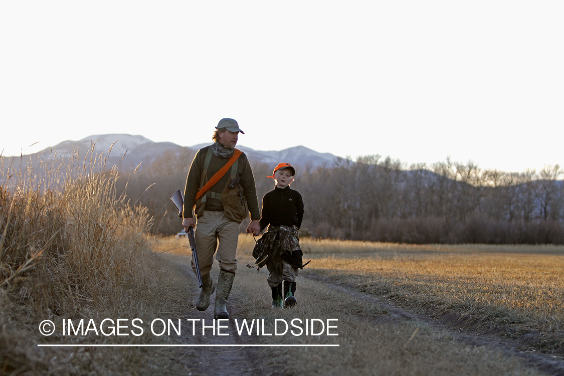 Father and son pheasant hunting.