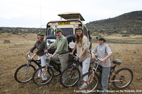 Family mountain biking on african safari