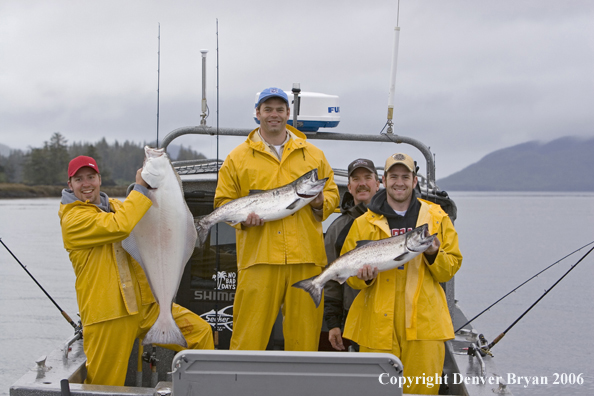 Fishermen with halibut and salmon catch.  (Alaska/Canada)