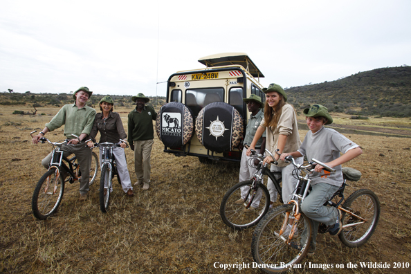 Family mountain biking on african safari