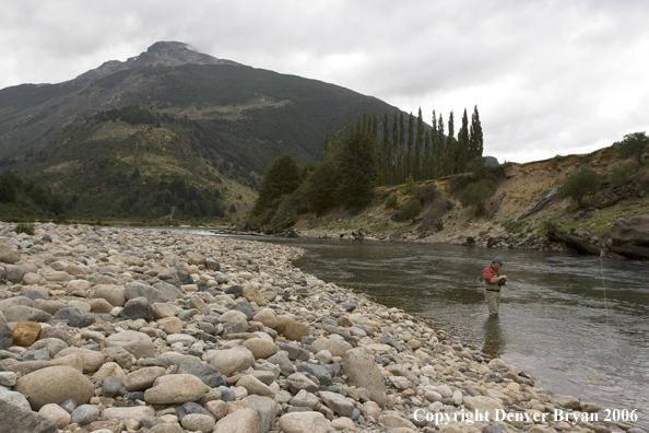 Flyfisherman casting on river.