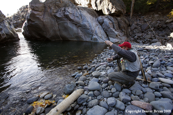 Flyfisherman with fish on at Slot Canyon