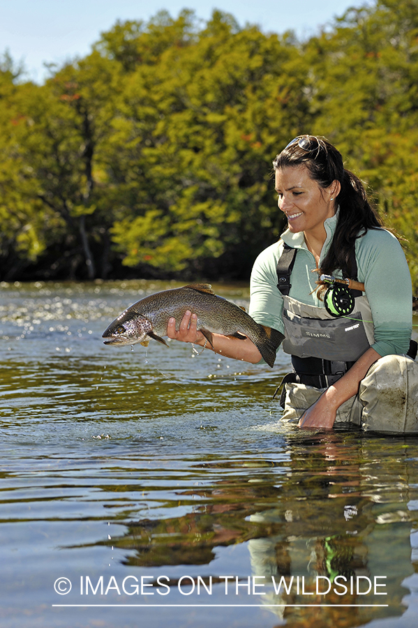 Flyfisher with rainbow trout.