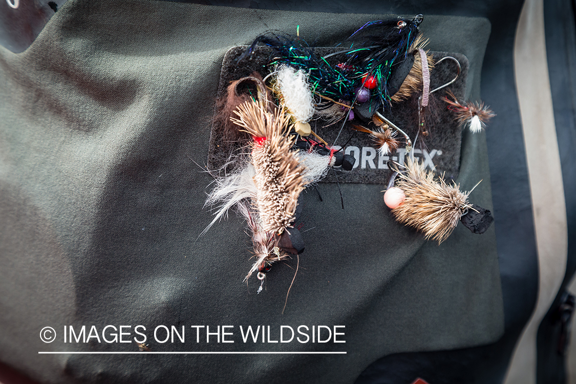 Fisherman with mouse pattern fly in Kamchatka Peninsula, Russia.