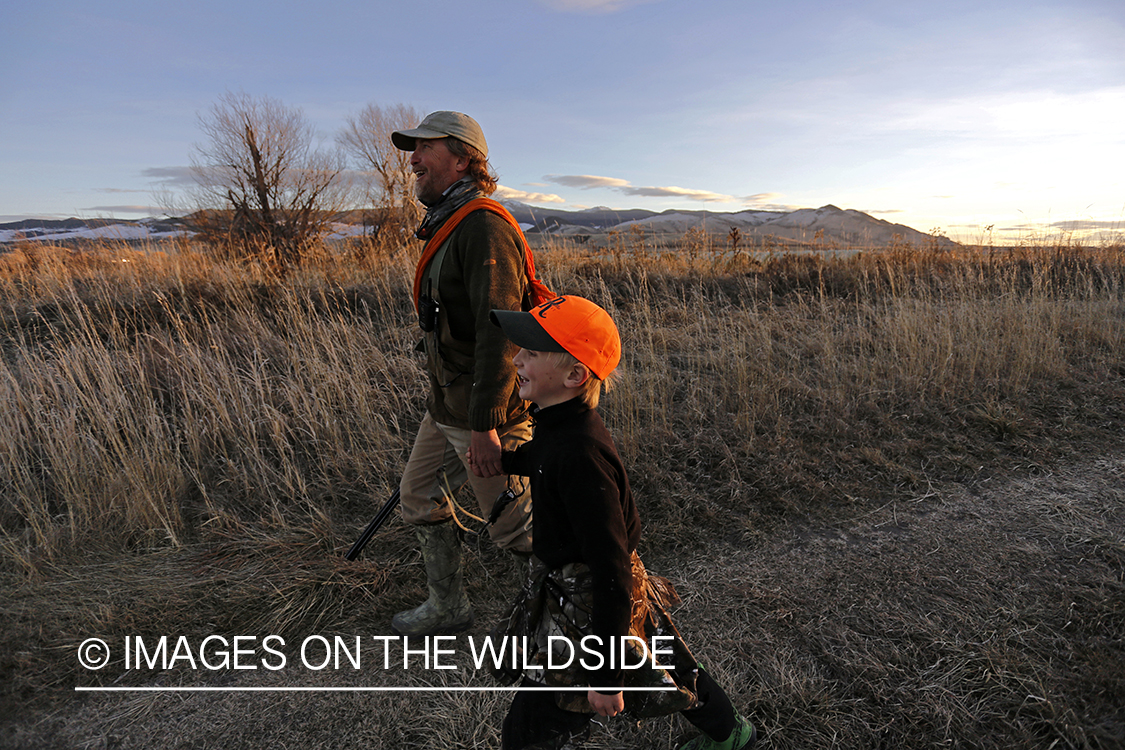 Father and son pheasant hunting.