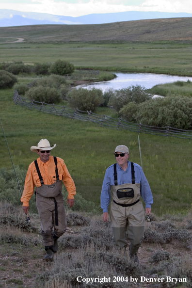 Flyfishermen walking back from river (MR)