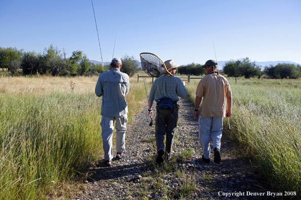 Flyfishermen walking to truck after a day of fishing