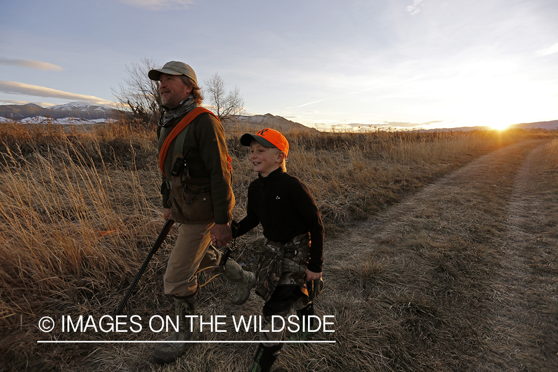 Father and son pheasant hunting.