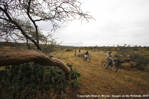 Family mountain biking on african safari