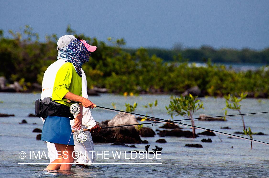 Flyfishing woman in flats.