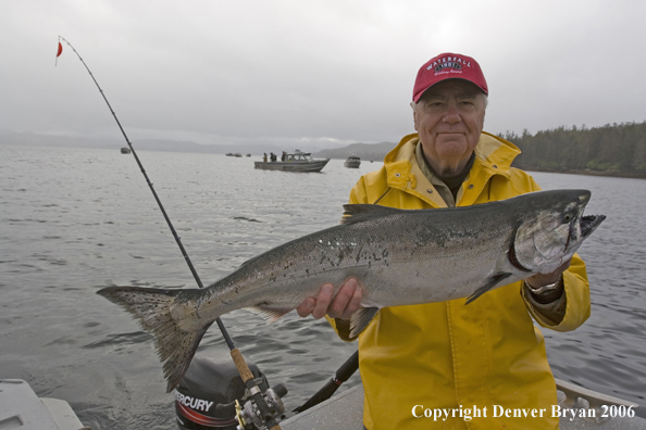 Fisherman holding a salmon.  