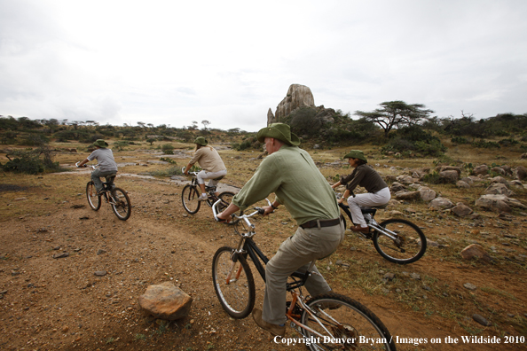 Family mountain biking on african safari