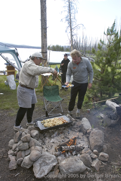 Flyfishermen at lakeside fishing camp.