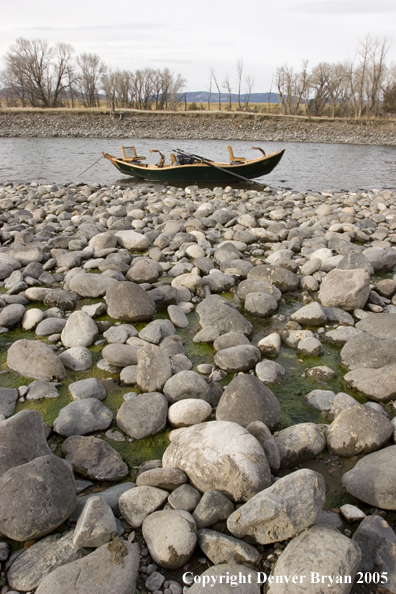 Drift boat on river.