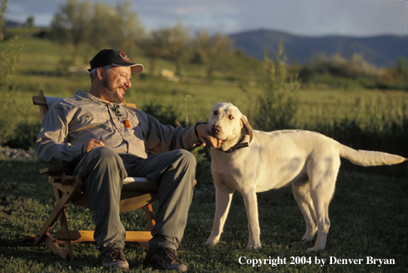 Yellow Labrador Retriever with owner 