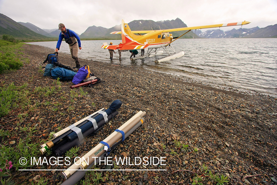 Flyfisherman unloading float plane.