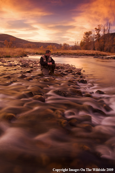 Flyfisherman on river.