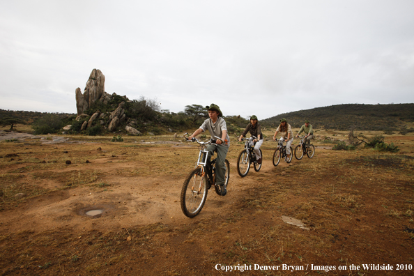 Family mountain biking on african safari