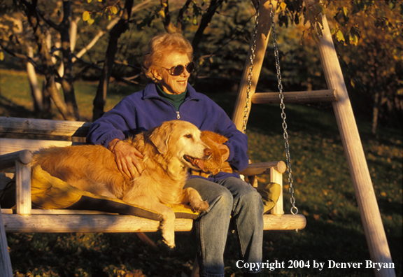 Woman with golden Retriever and cat