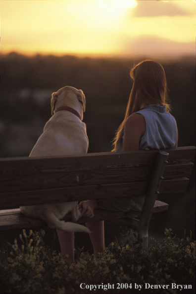 Woman with yellow Labrador Retriever