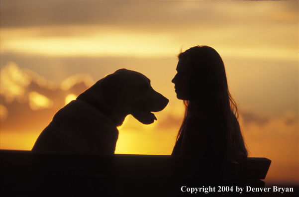 Woman with yellow Labrador Retriever