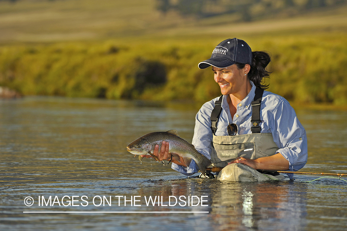 Flyfisher with rainbow trout.