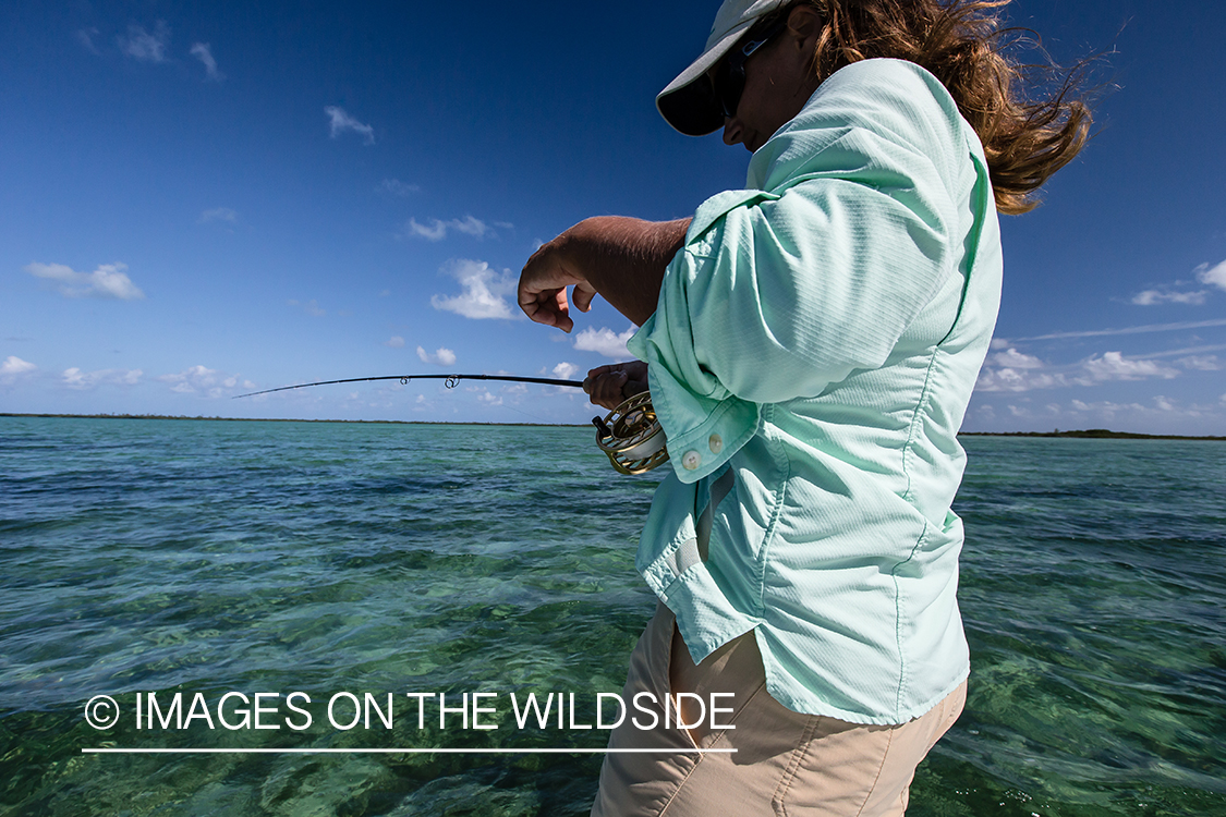 Flyfishing woman in flats.